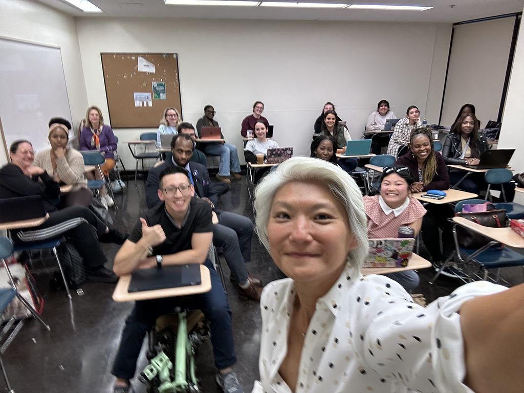 Senator Iwen Chu takes a selfie in front of the class