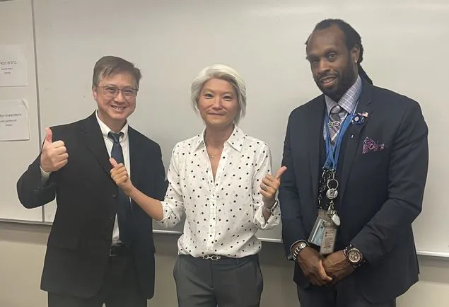 Adjunct Professor Kin Mark, Adjunct Assistant Professor Dr. Jude Arthur, stand with visiting Senator Iwen Chu