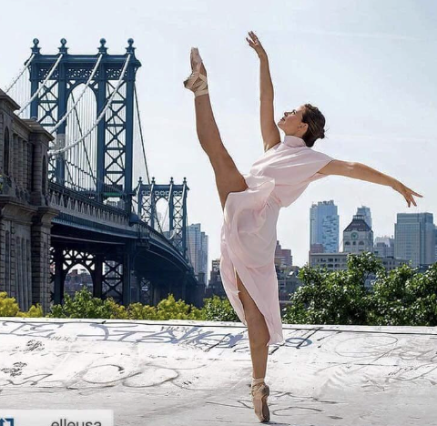 Jacquelyn Scafidi Allsopp dancing in front of the Brooklyn Bridge