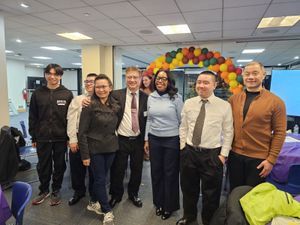 Kin Mark and Family, Senator John Liu on the right in a brown-yellowish sweater, Councilwoman Rita Joseph in center