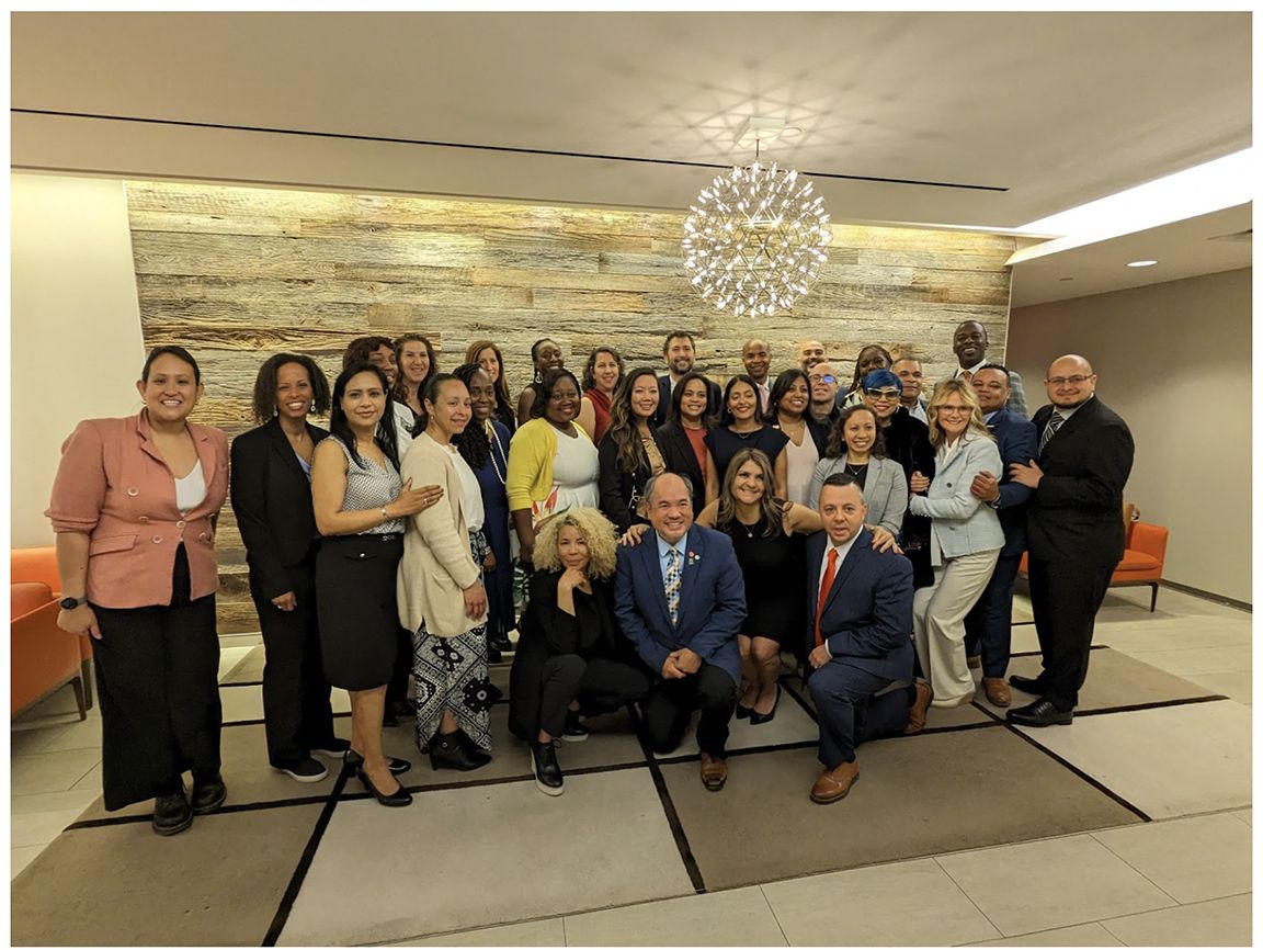 The Gray Fellows 2023 to 2024 "Phoenix V" cohort gathers in a lobby.