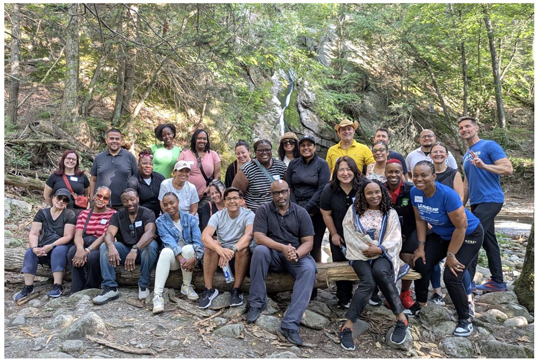 The 2025 to 2026 Gray Fellows "Solaris" Cohort gathers outside in nature.