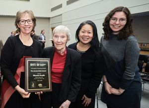 Rhonda Bondie poses with her award. From left to right are her mother, Mary Ann Bondie, Dr. Jen Samson (Hunter College), and Rhonda's Daughter, Kristen Clevinson, Hunter College MA 2002